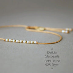 Armband in Gold - Rotbraun "Delica Fine Pearls" Textilband + Schiebeknoten_Schmuck_handmade_animoART