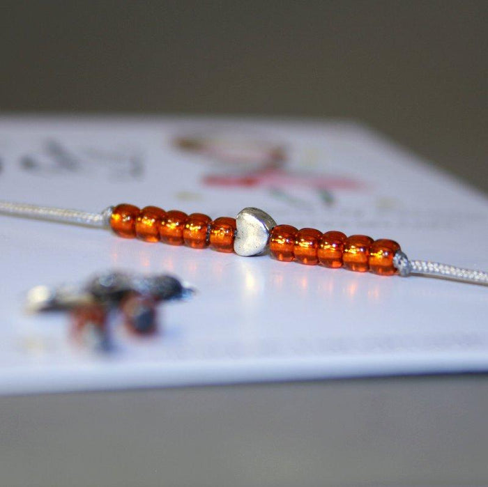 Kinder-Armband "Herz" mit Rocailles-Perlen in orange
