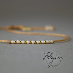 Armband in Gold - Rotbraun "Delica Fine Pearls" Textilband + Schiebeknoten_Schmuck_handmade_animoART