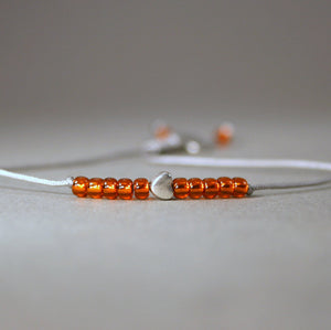 Kinder-Armband "Herz" mit Rocailles-Perlen in orange - animoART